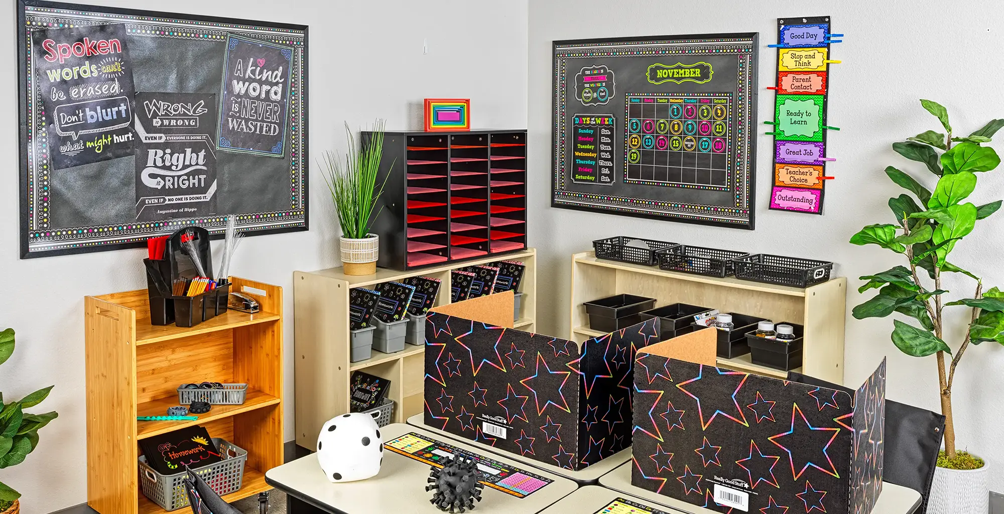 Classroom decorated with black chalkboard designs and bright neon accents
