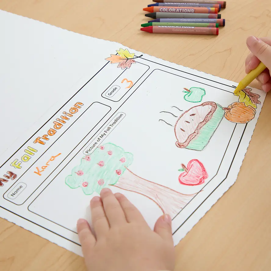 Child coloring a ready-to-decorate classroom activity